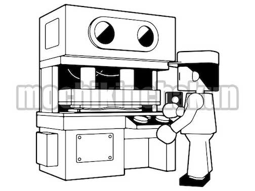 プレス機を操作する作業員