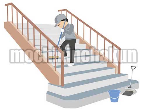 階段を掃く清掃業者